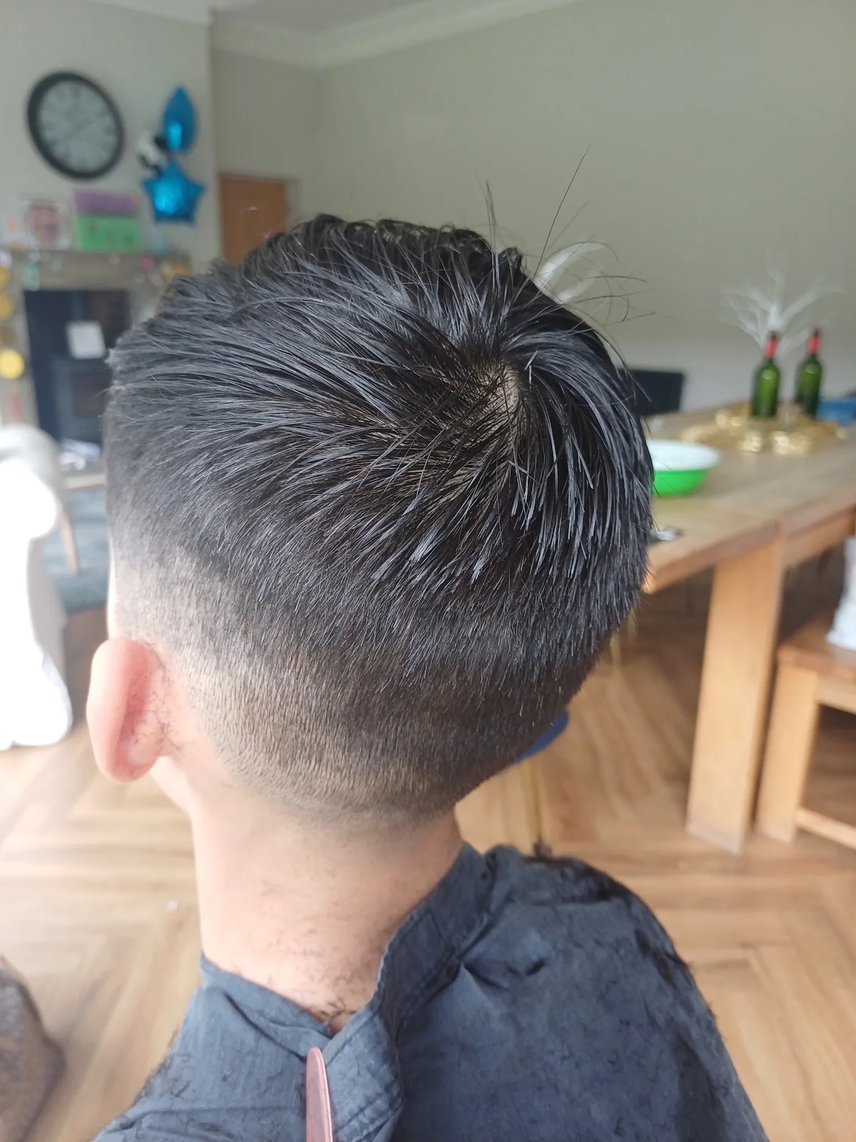 Neatly shaped short dark haircut