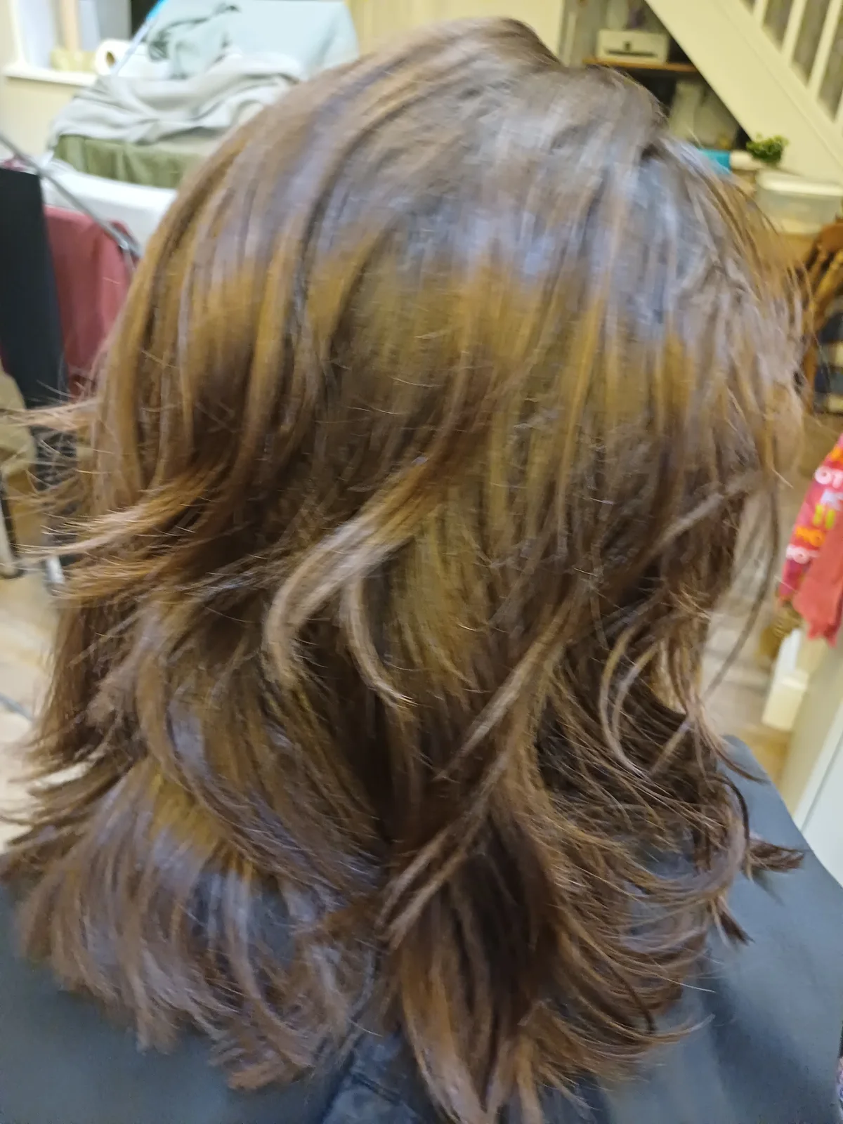 Brunette hair finished with loose curls